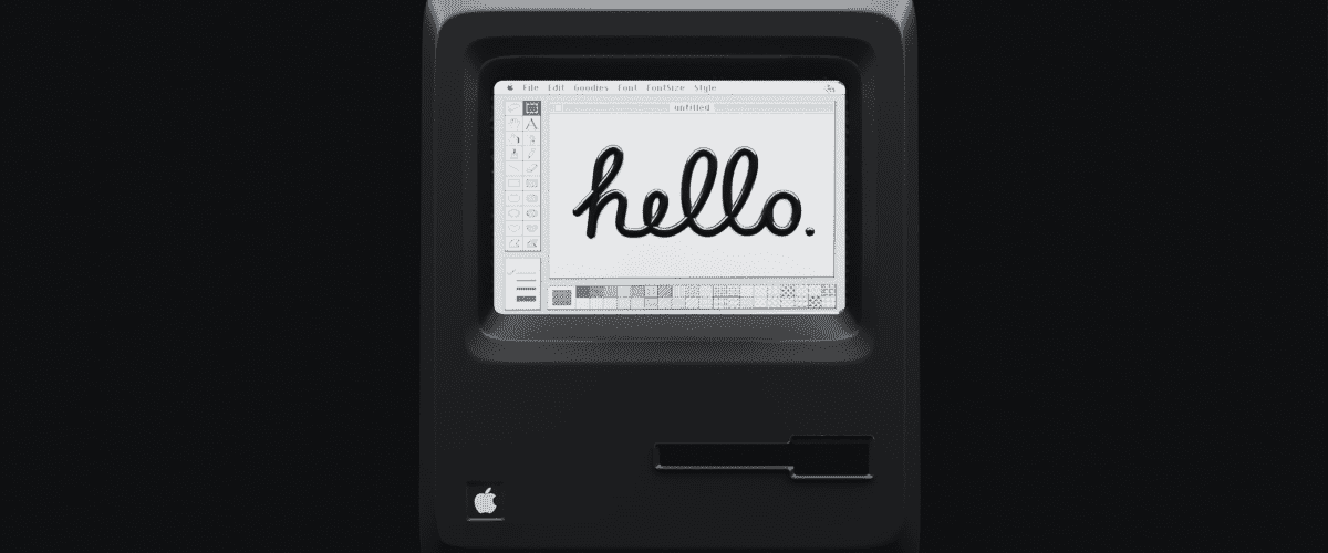Ancien ordinateur Mac avec écrit "hello"